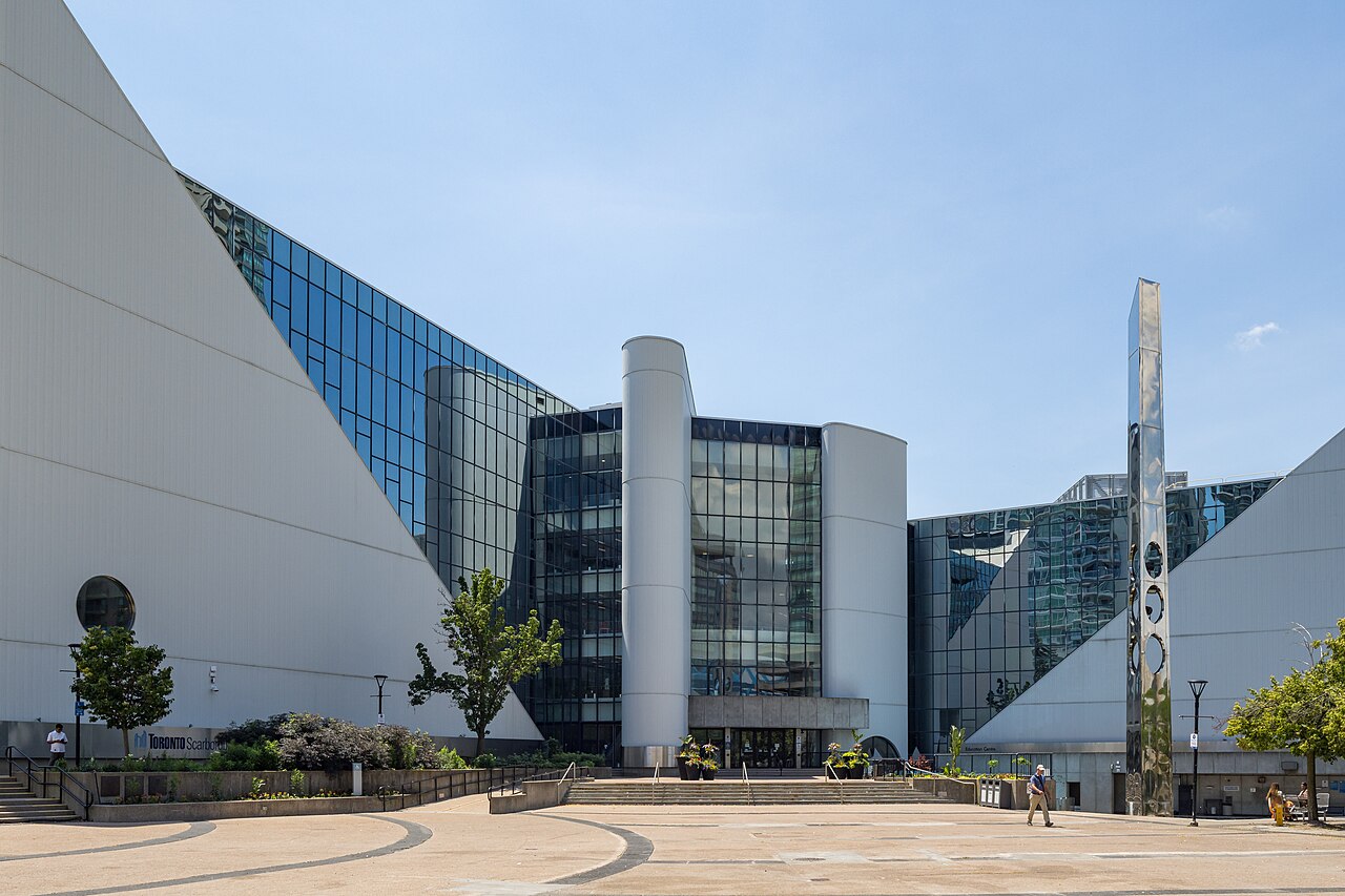 Scarborough Civic Centre’s white curved wings and glass facade overlooking the outdoor Albert Campbell Square plaza.